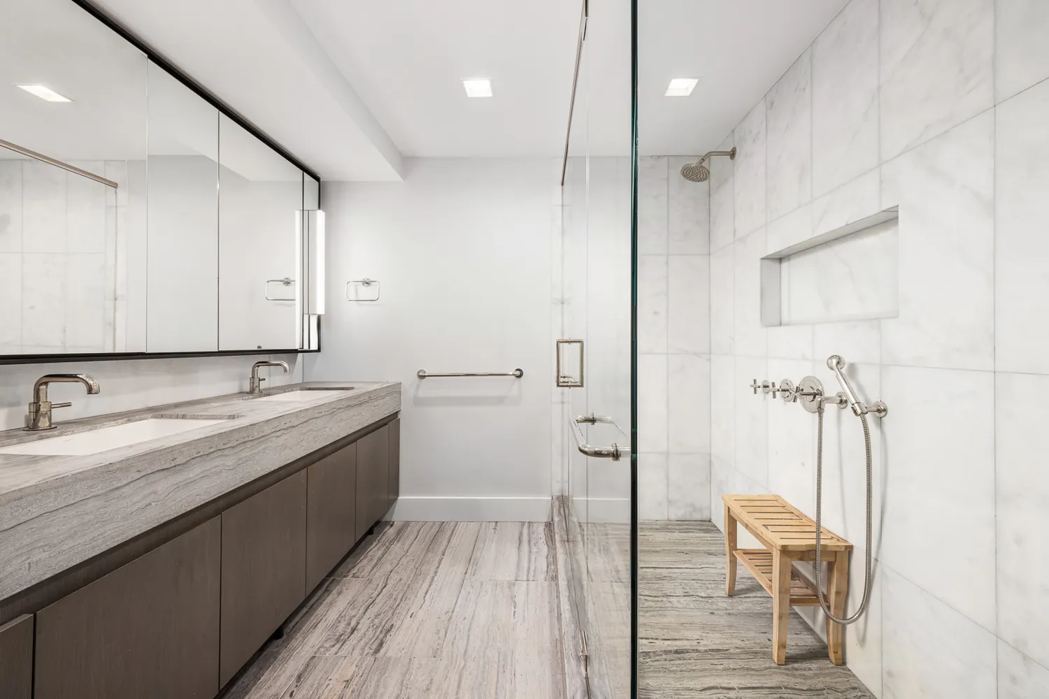 a bathroom with a double vanity sink and a mirror
