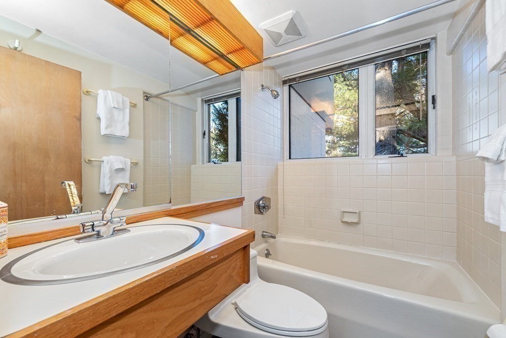 5 Field Road Lexington, MA 02421 - Photo 10 of 17 a bathroom with a sink toilet bathtub and shower