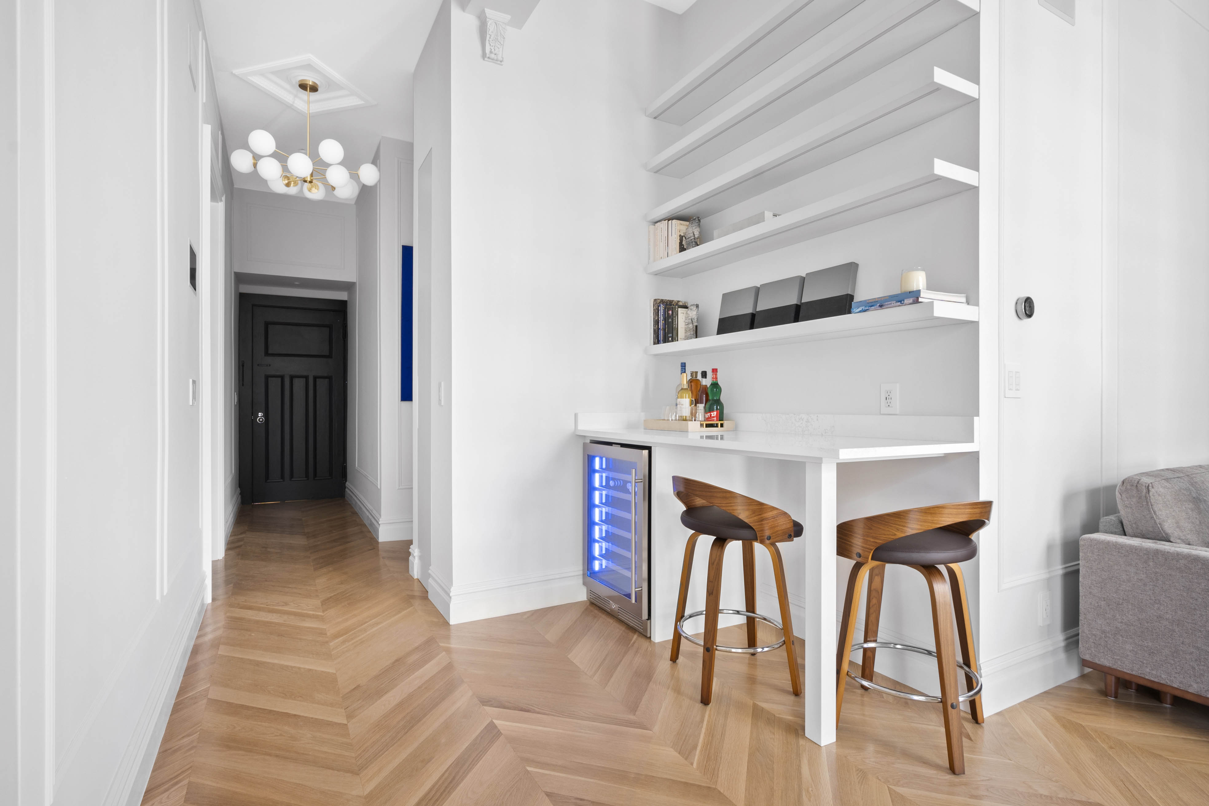 33 West 67th Street, Unit 4M Manhattan, NY 10023 - Photo 6 of 16 a view of a hallway with furniture and wooden floor