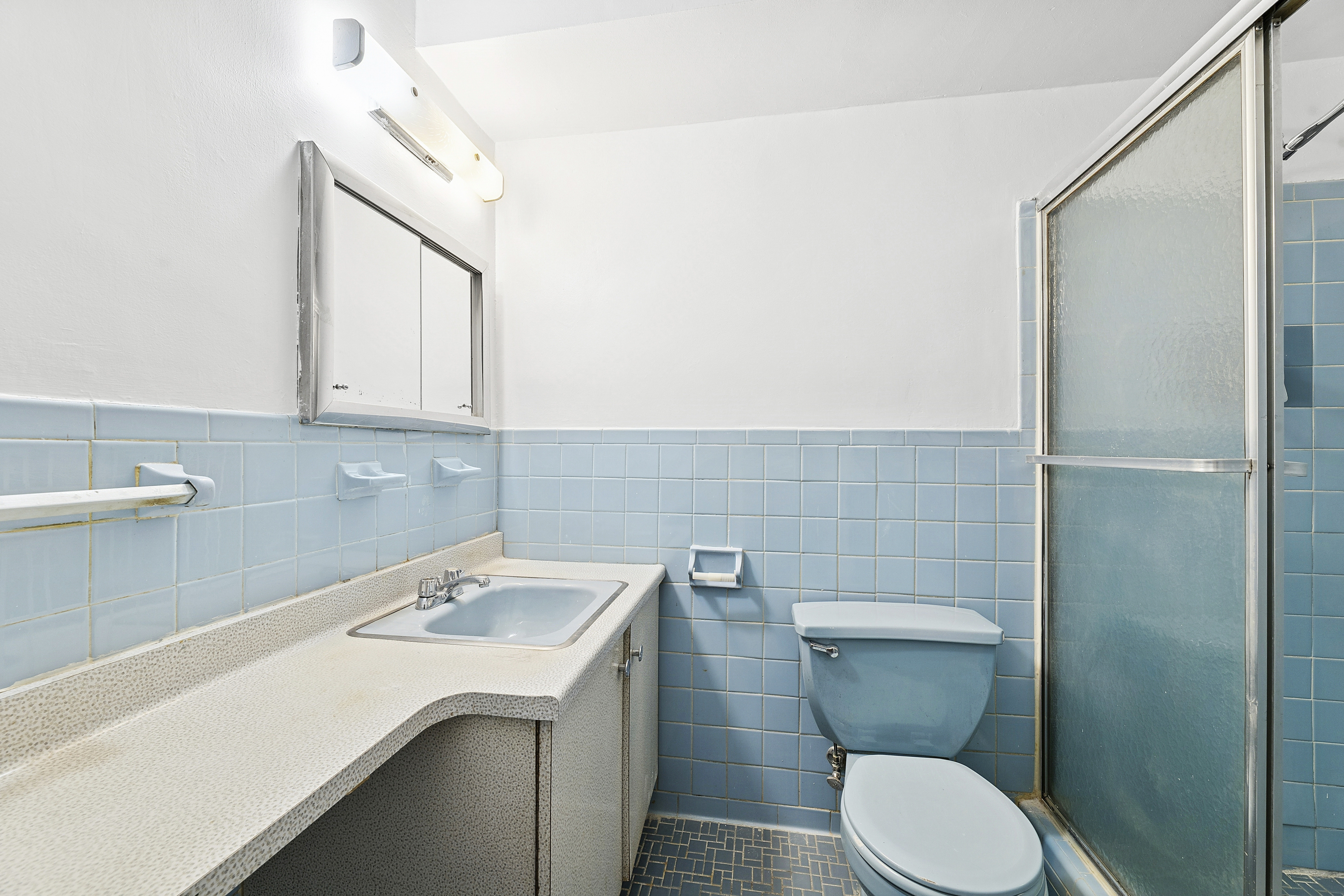 3755 Henry Hudson Parkway West, Unit 3F Bronx, NY 10463 - Photo 14 of 17 a bathroom with a sink a toilet and a mirror