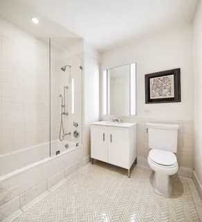 a bathroom with a toilet sink and a bathtub
