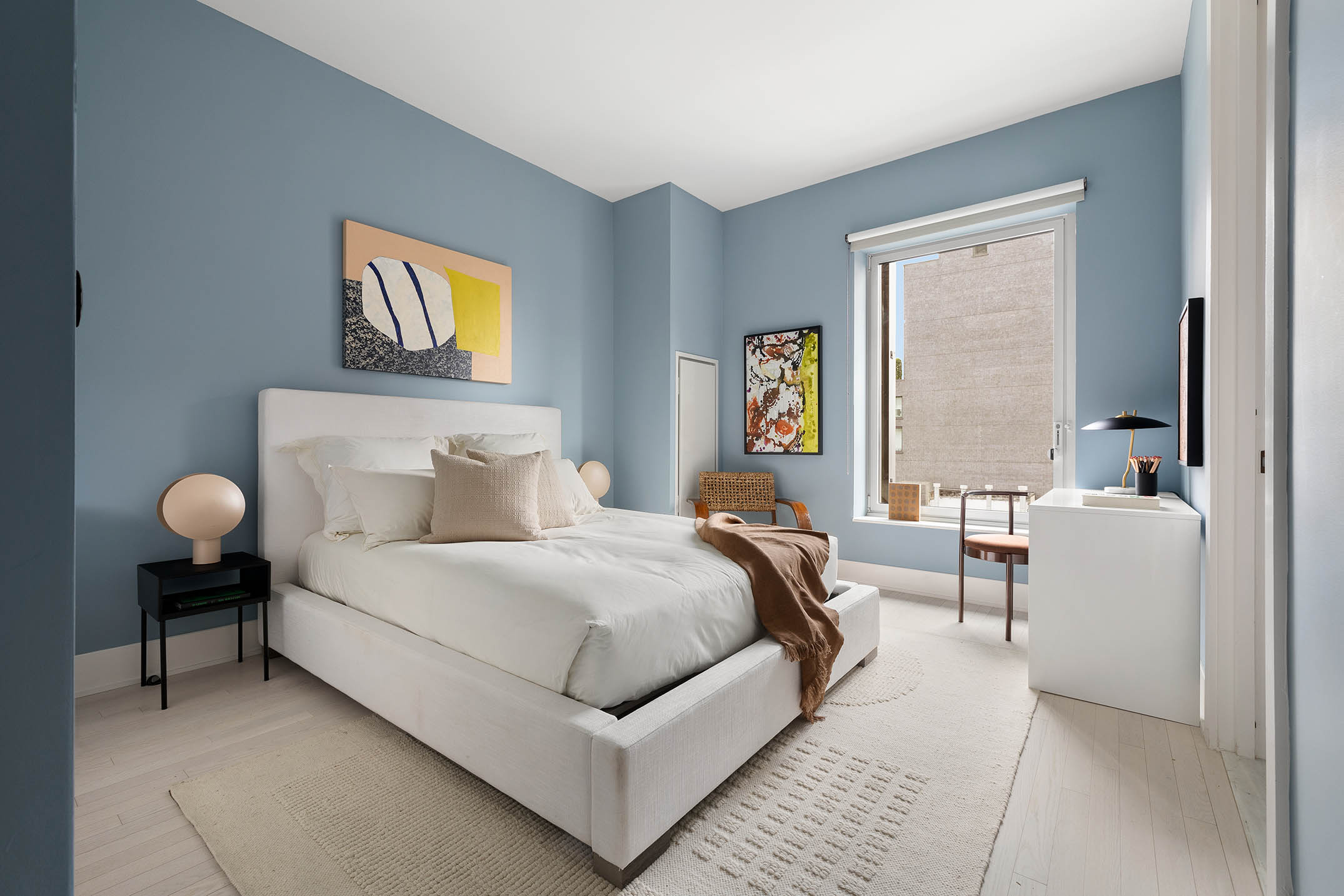 91 Leonard Street, Unit 14A Manhattan, NY 10013 - Photo 16 of 27 a bedroom with bed and a window