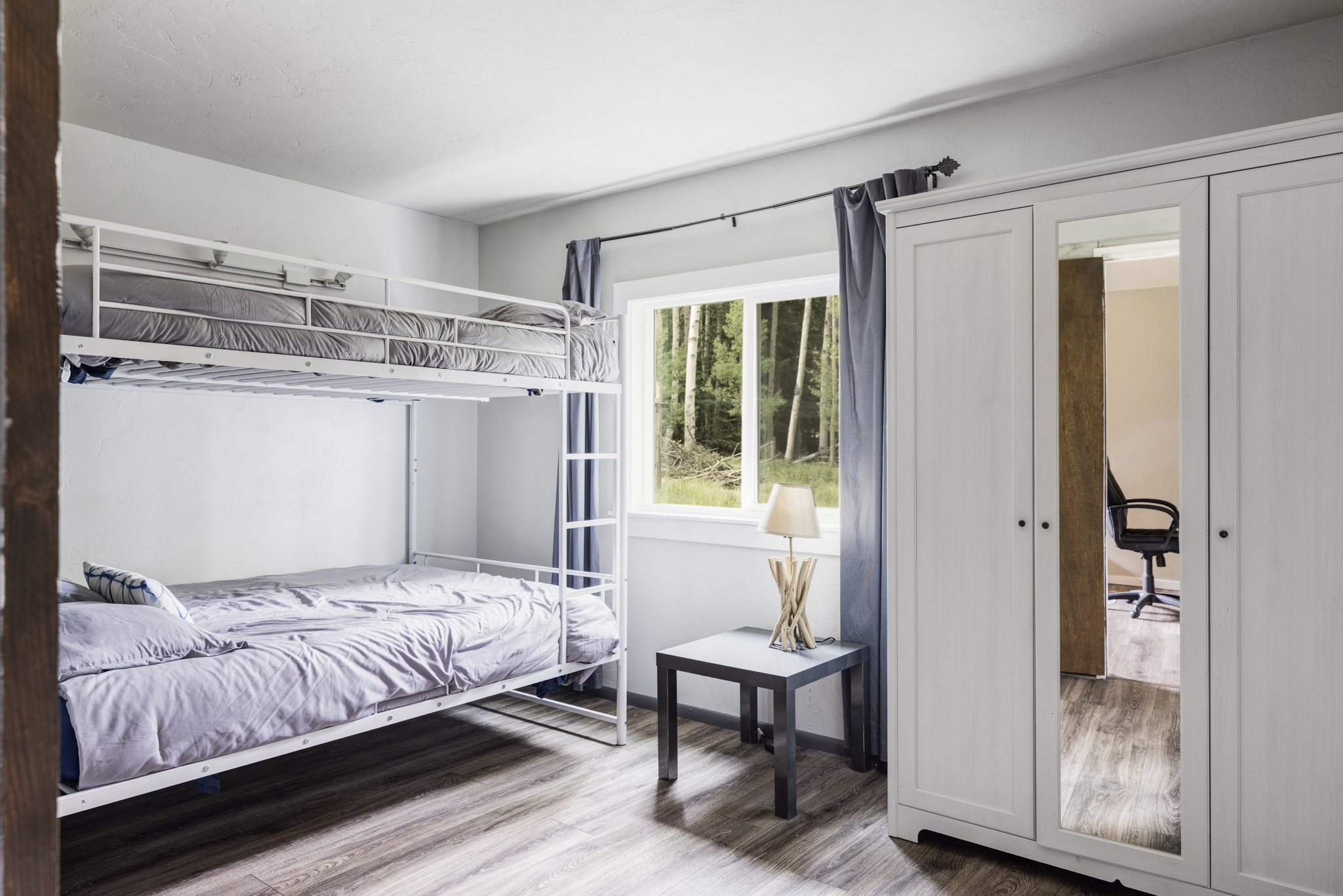 133 Gold Run Road Alma, CO 80420 - Photo 25 of 46 a bedroom with a bed and a window