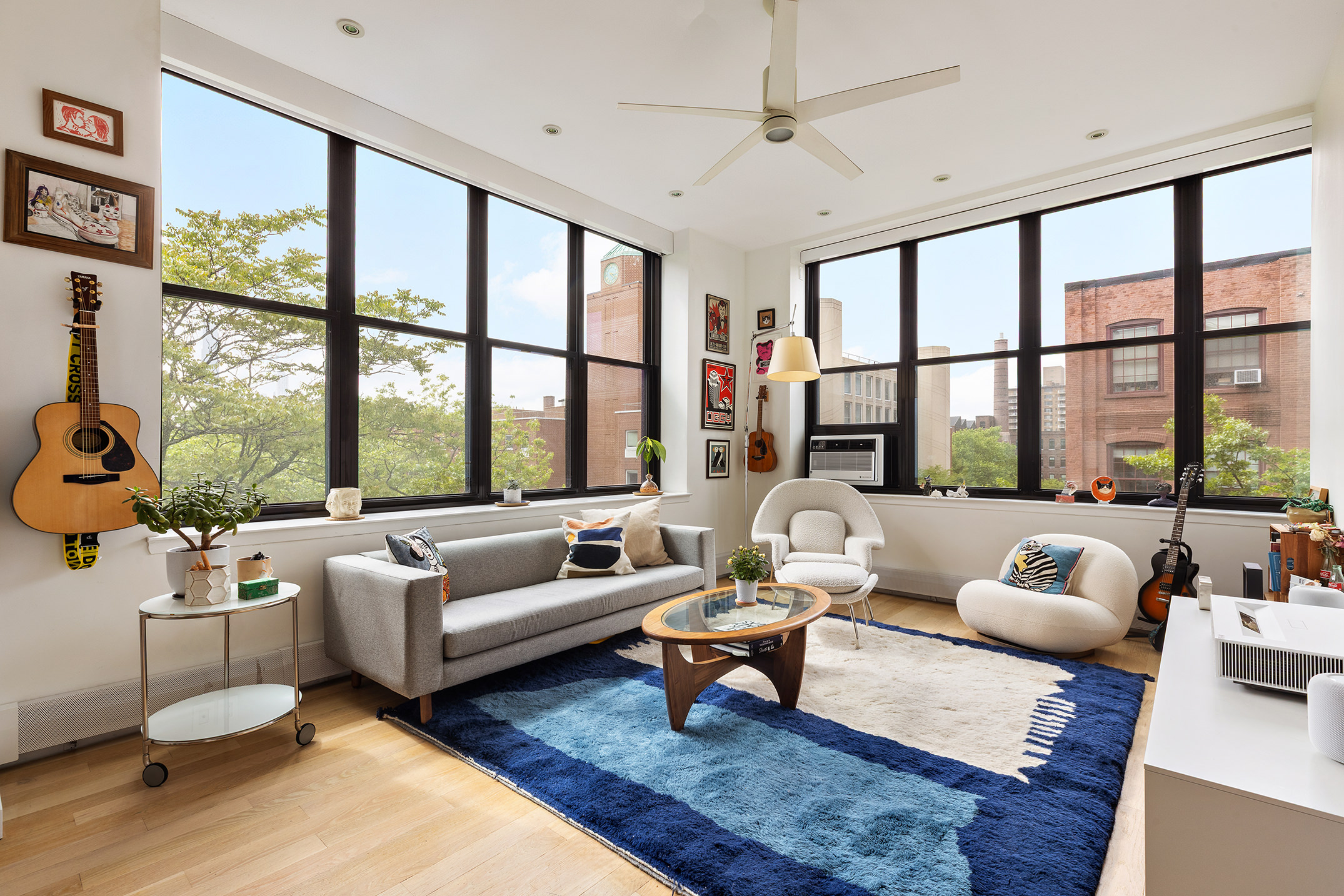 372 Dekalb Avenue, Unit 5J Brooklyn, NY 11205 - Photo 1 of 10 a living room with furniture and a large window