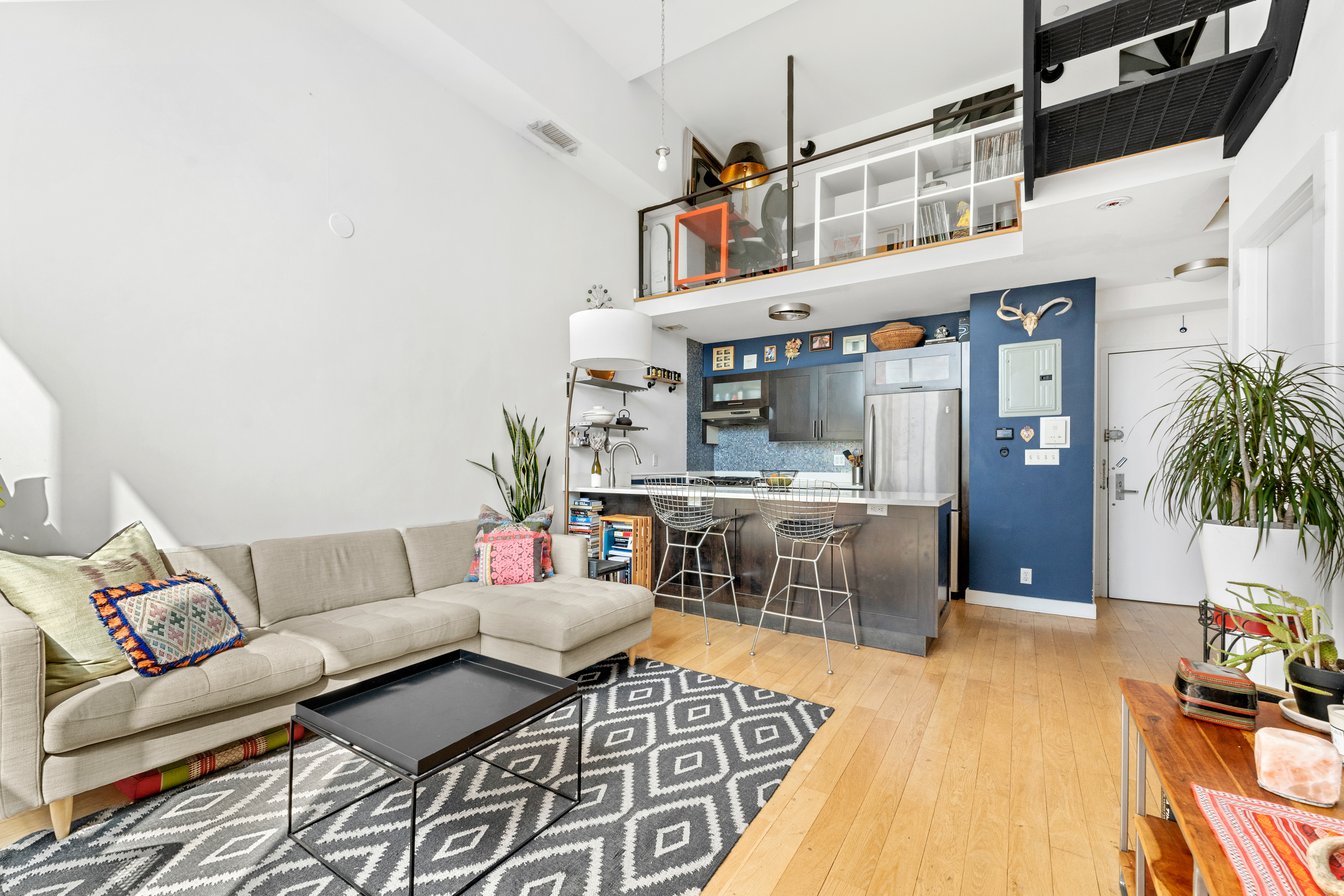 151 Manhattan Avenue, Unit 4B Brooklyn, NY 11206 - Photo 2 of 11 a living room with furniture and a couch