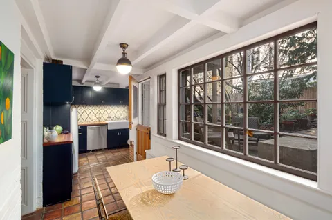a lobby with furniture wooden floor and window