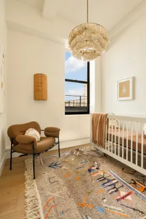 a bedroom with furniture and a window