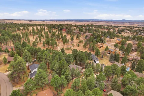 an aerial view of city and mountain