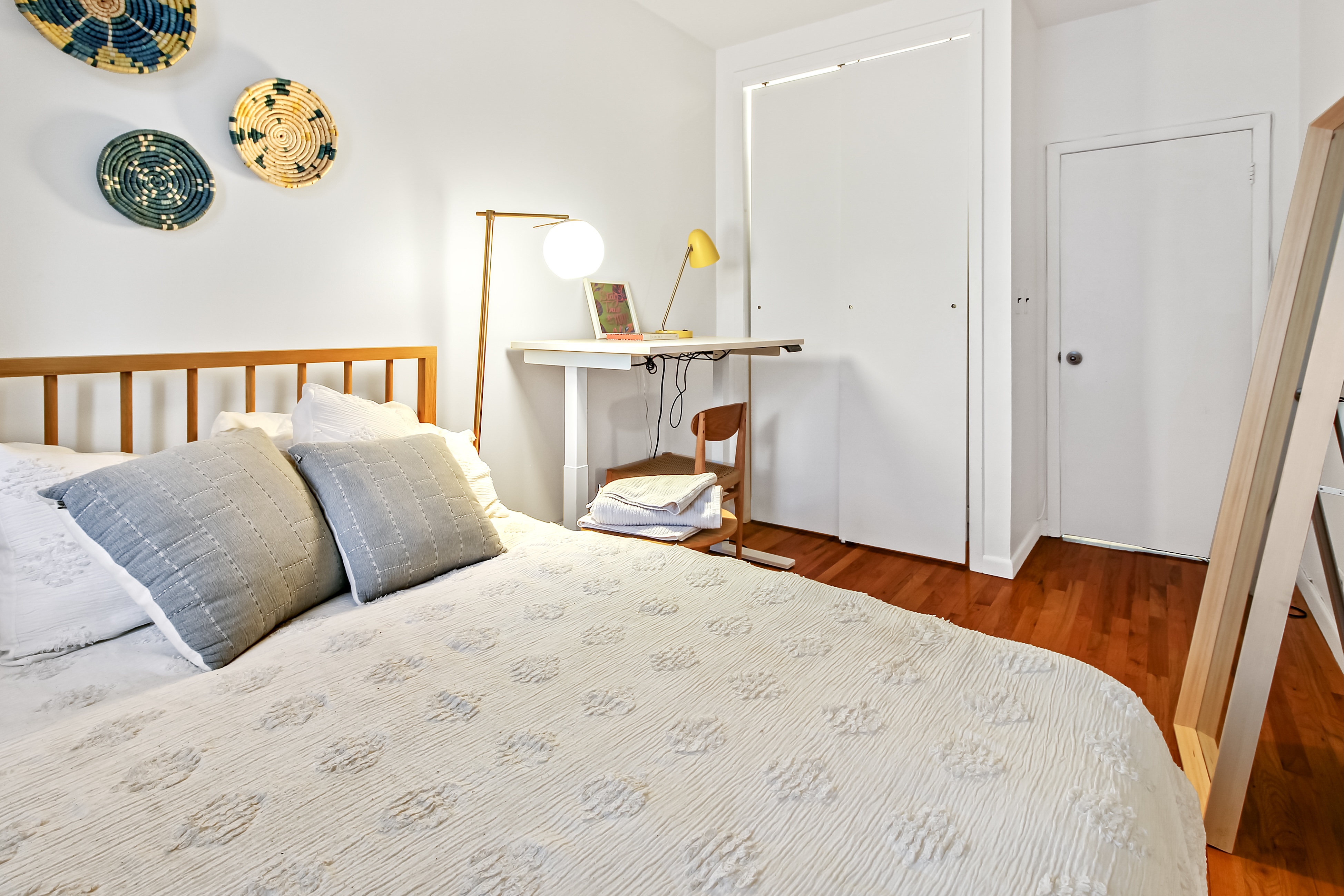 621 2nd Avenue, Unit 2 Manhattan, NY 10016 - Photo 4 of 8 a bedroom with a bed and painting on the wall