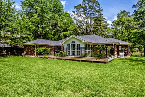 a view of outdoor space with deck and yard