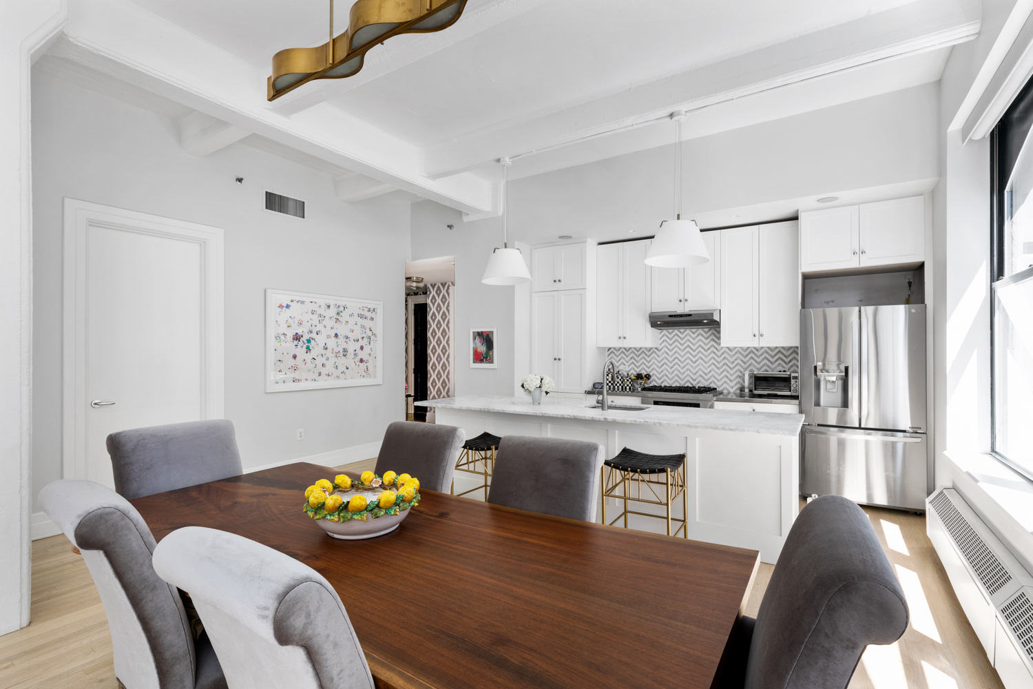 30 Main Street, Unit 3C Brooklyn, NY 11201 - Photo 6 of 18 a kitchen with stainless steel appliances granite countertop a dining table and chairs