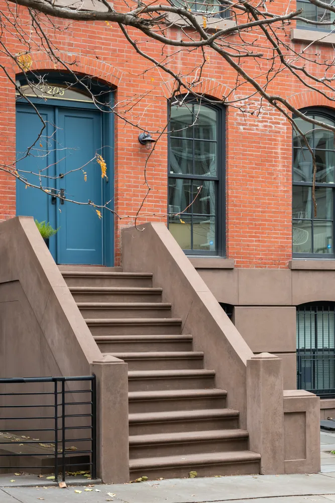 a view of a house with a street