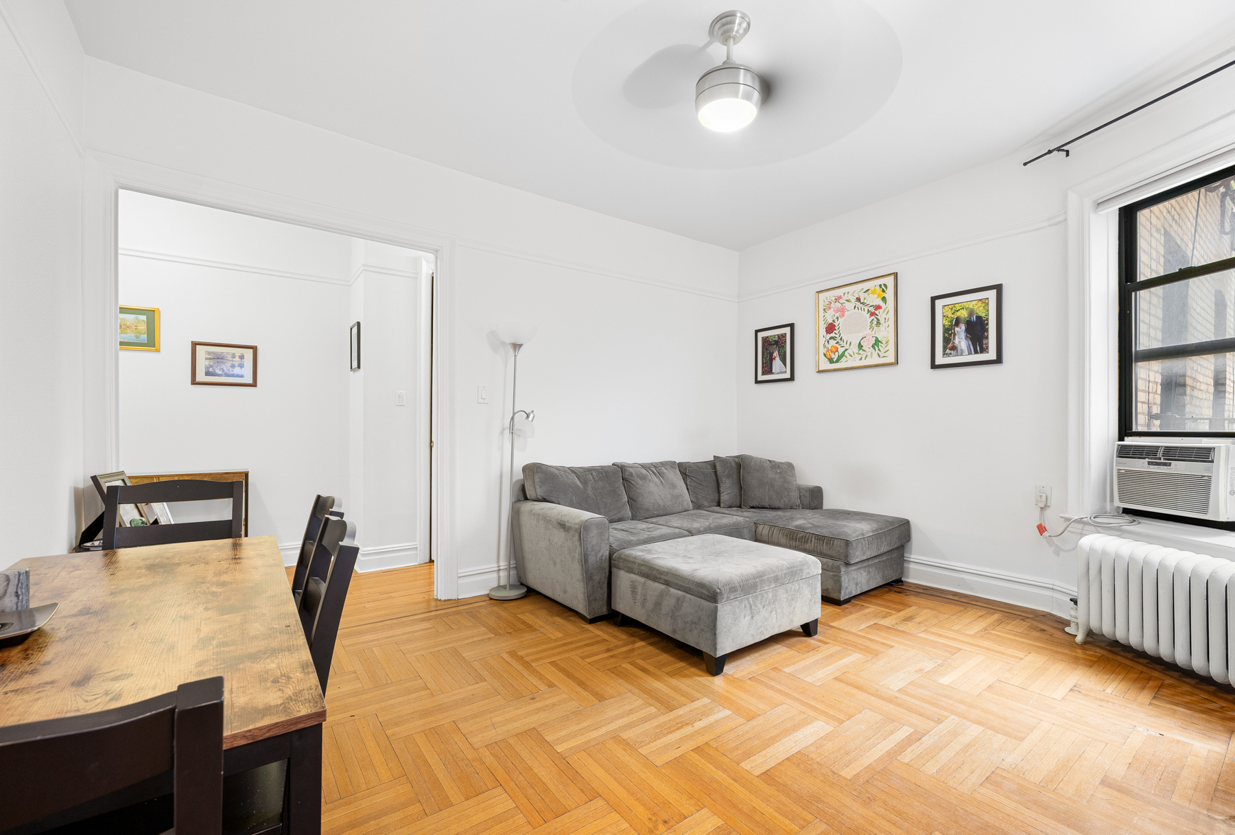 255 Eastern Parkway, Unit C5 Brooklyn, NY 11238 - Photo 3 of 9 a living room with furniture and a window