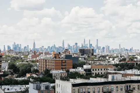 a view of a city with tall buildings
