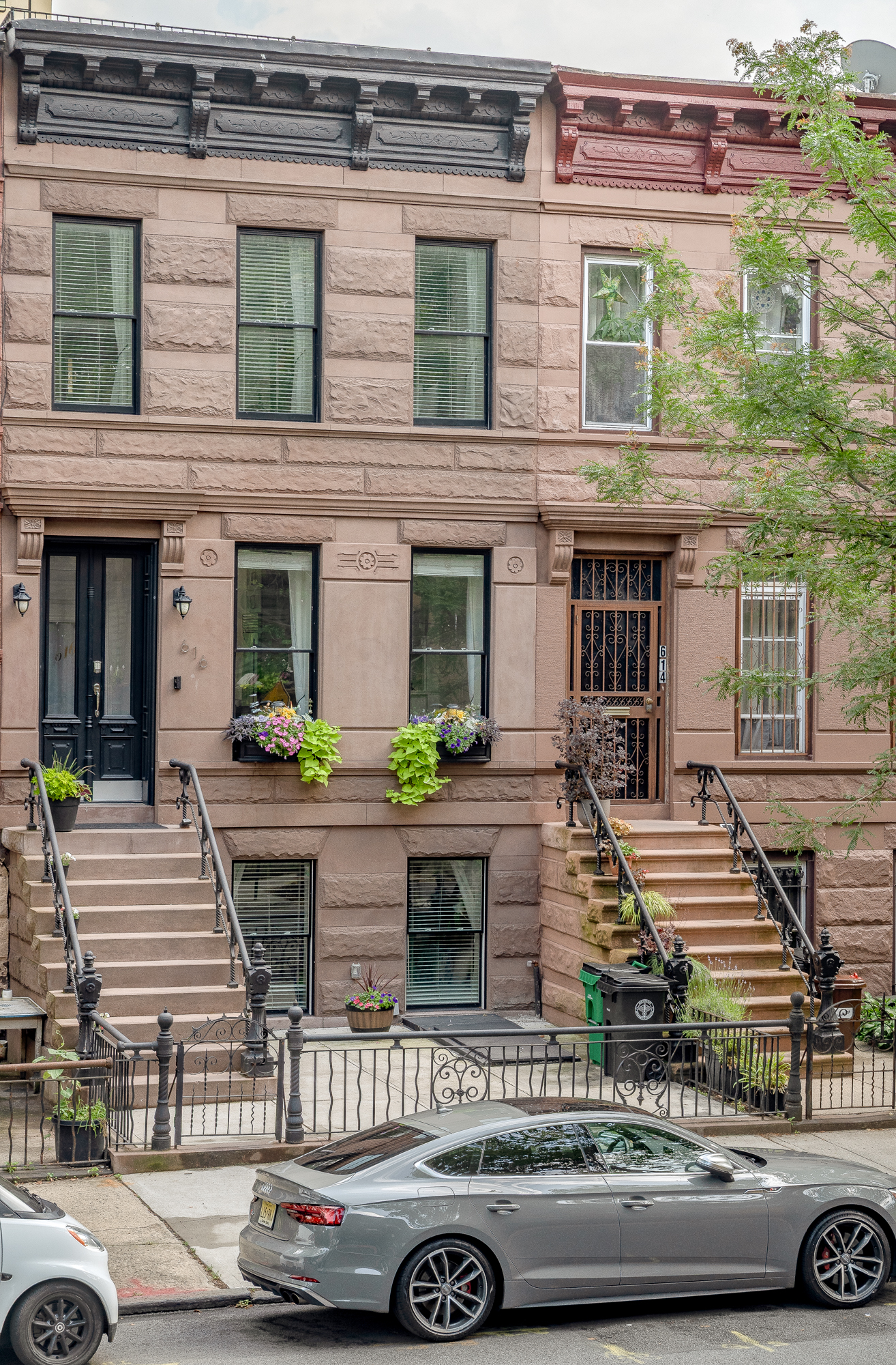 616 MacDonough Street, Unit 2 Brooklyn, NY 11233 - Photo 11 of 12 a front view of a house with car parked