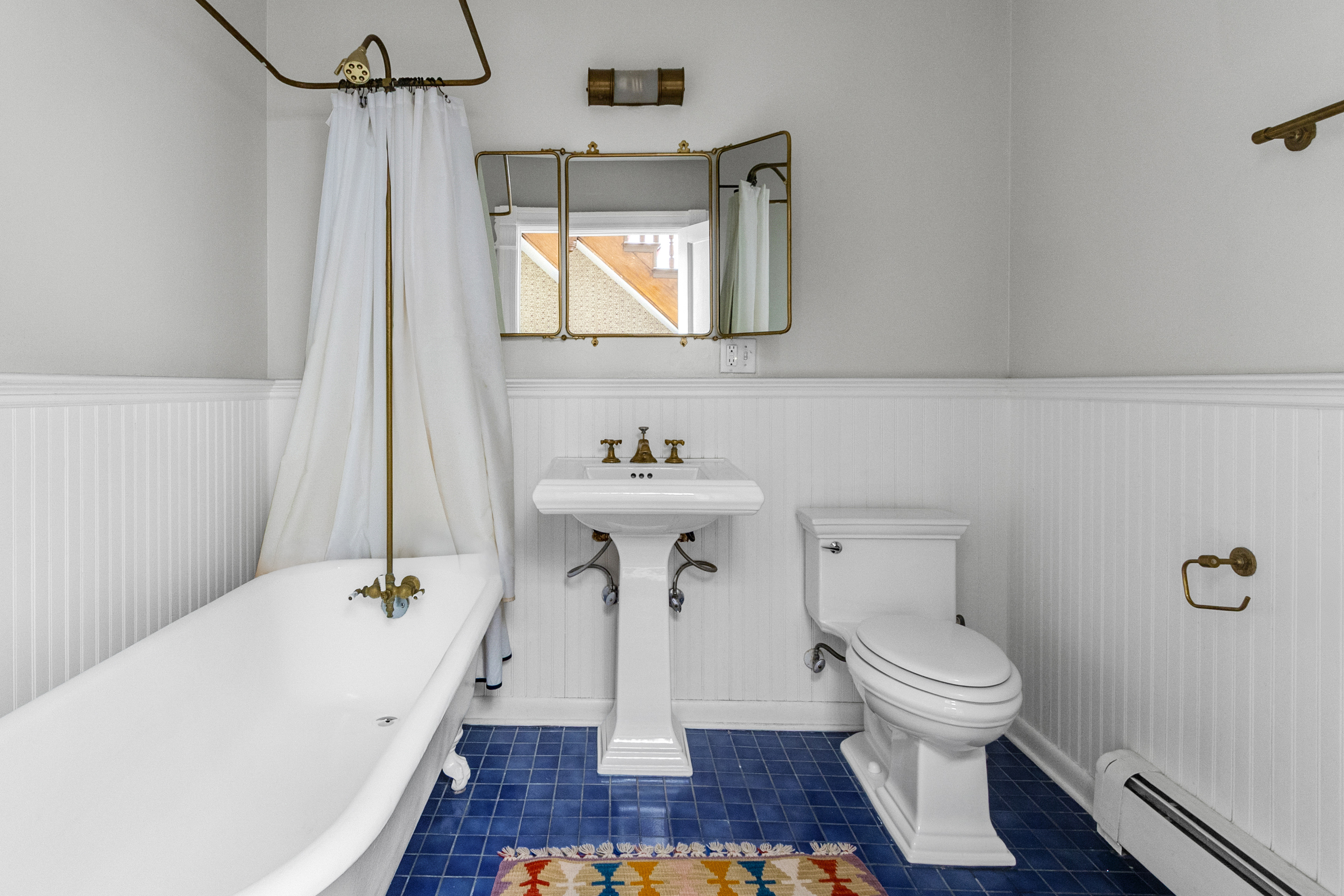 125 West 132nd Street Manhattan, NY 10027 - Photo 15 of 21 a bathroom with a sink a toilet and shower