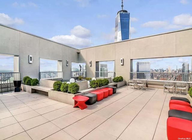 123 Washington Street, Unit 52F Manhattan, NY 10006 - Photo 13 of 15 a outdoor space with lots of white furniture