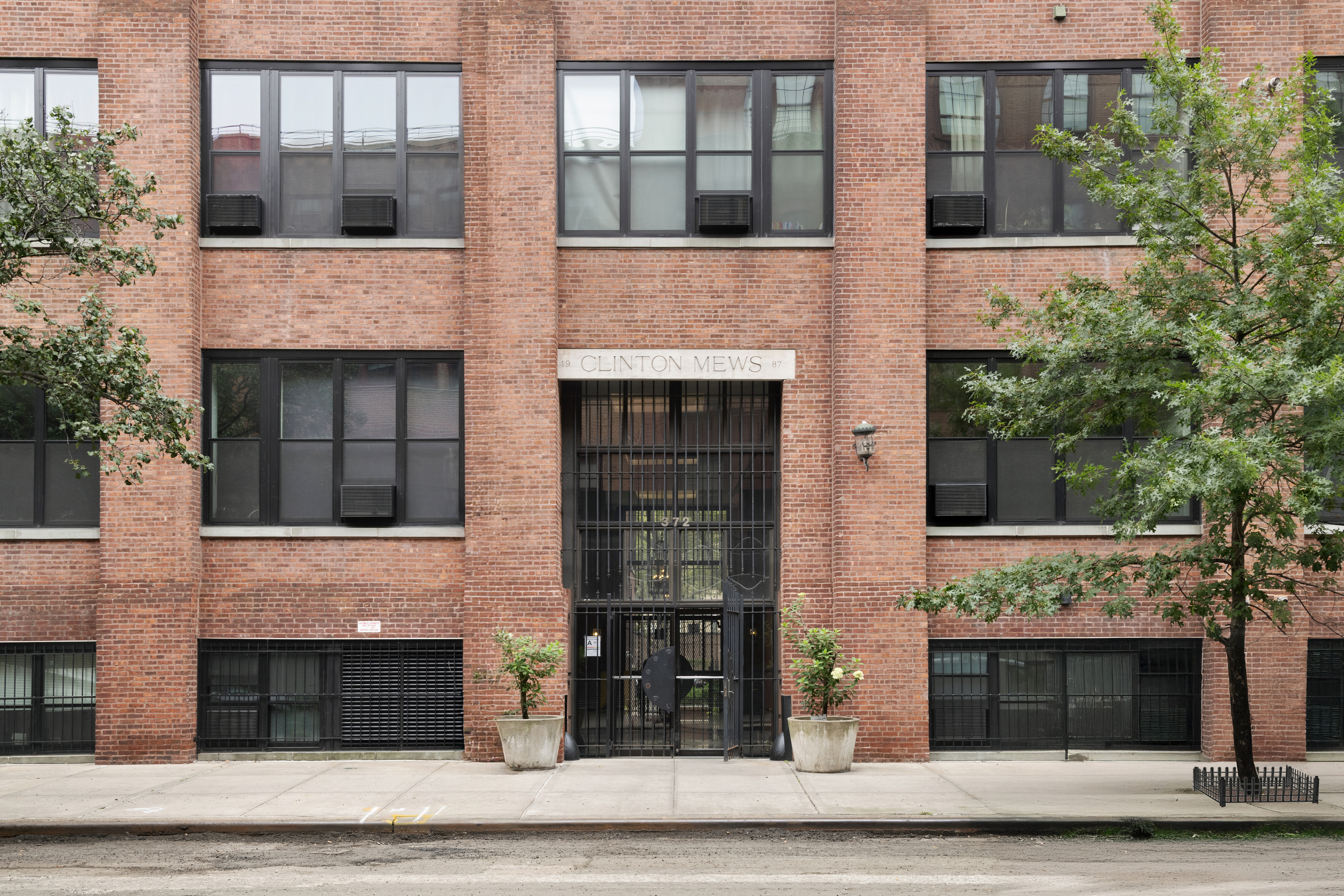 372 Dekalb Avenue, Unit 6E Brooklyn, NY 11205 - Photo 15 of 16 a front view of a house with garage