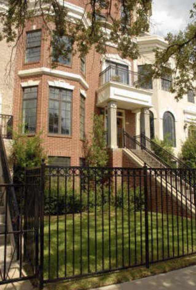 a view of a brick house with many windows