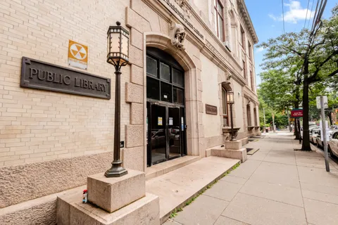 a street sign on a brick building