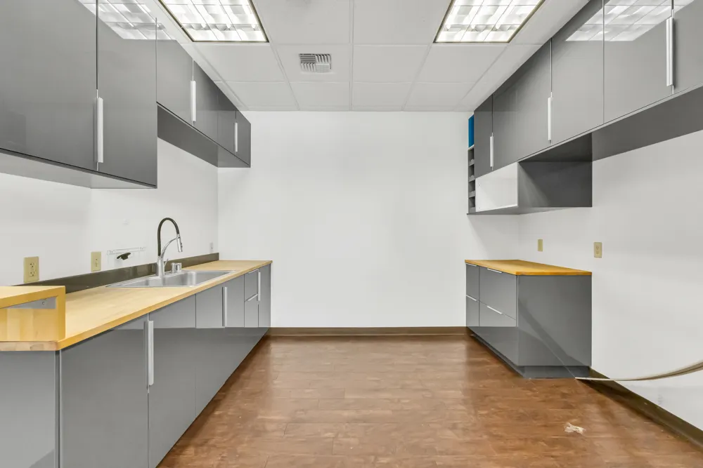 a view of a kitchen with a sink and a microwave