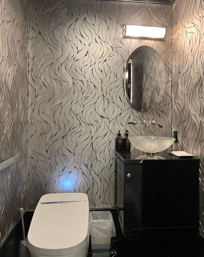 a bathroom with a sink toilet and mirror