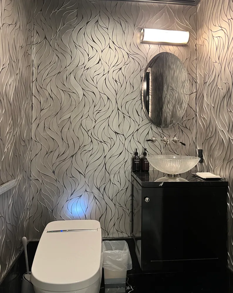 a bathroom with a sink toilet and mirror