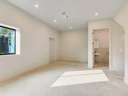 a kitchen with granite countertop white cabinets and sink