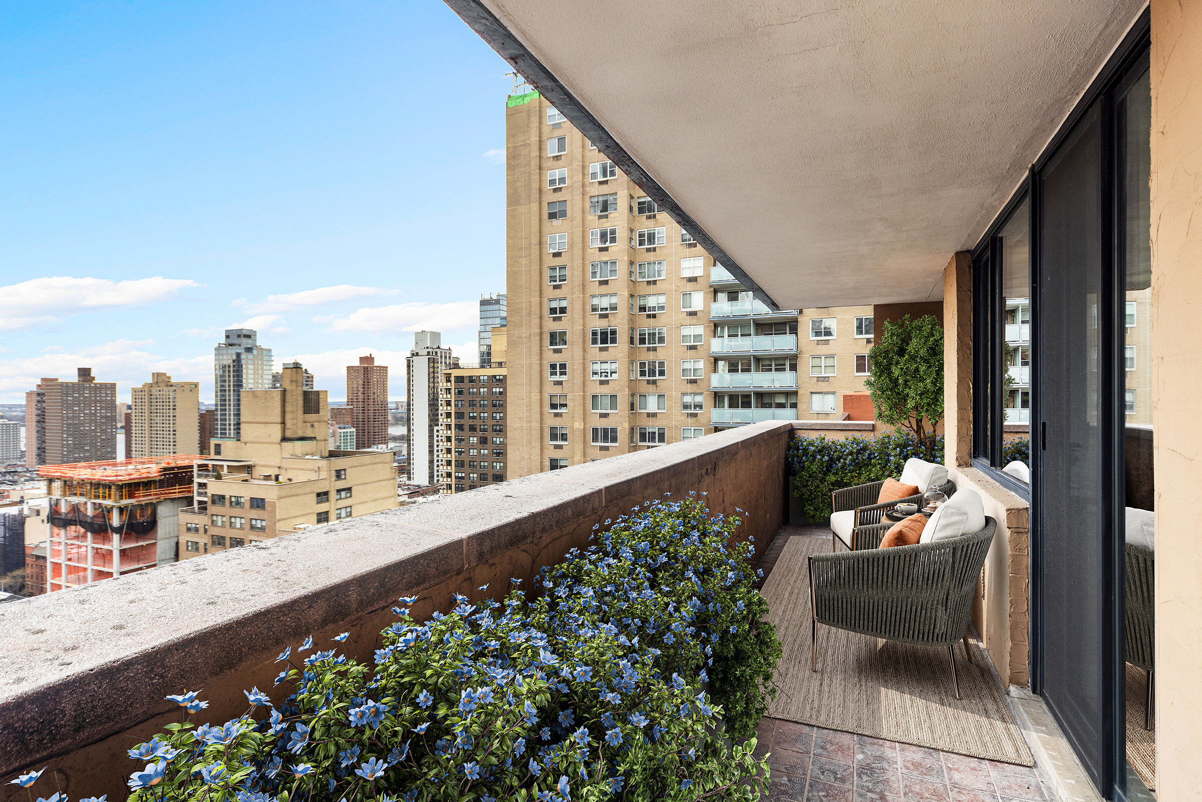 233 East 86th Street, Unit PHB Manhattan, NY 10028 - Photo 11 of 12 a balcony with furniture and a potted plant