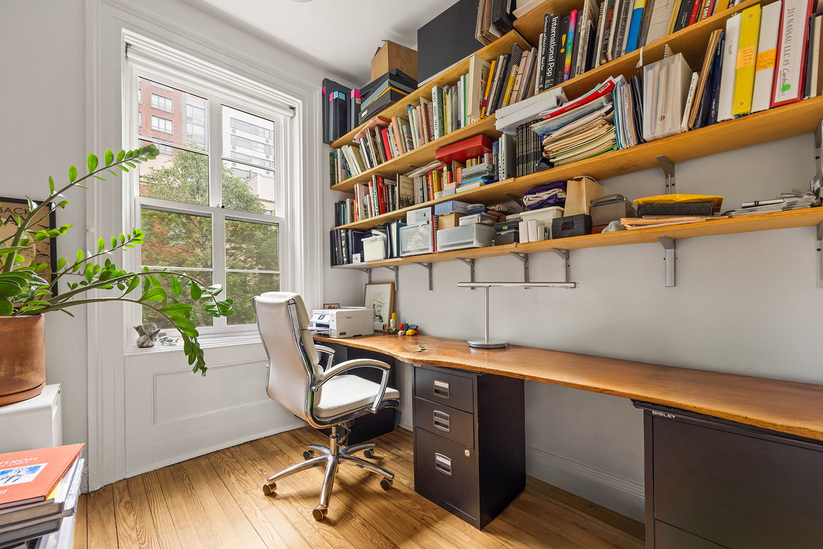 298 State Street, Unit TRIPLEX Brooklyn, NY 11201 - Photo 12 of 21 a view of a workspace with furniture and a window