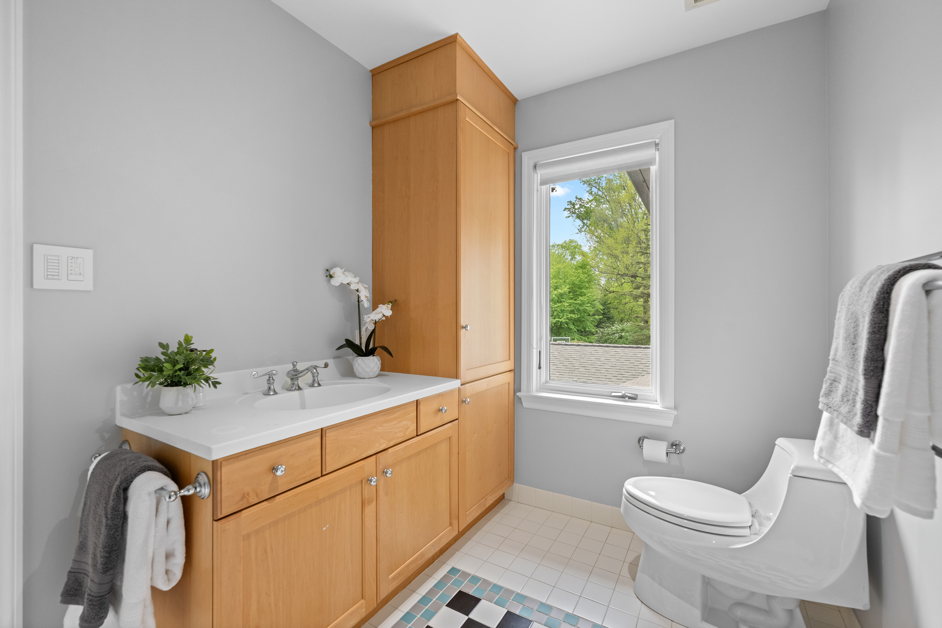 850 Lesley Road Villanova, PA 19085 - Photo 32 of 45 a bathroom with a granite countertop sink mirror vanity and toilet