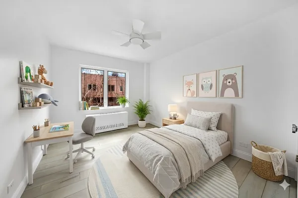 a bedroom with a bed and a large window