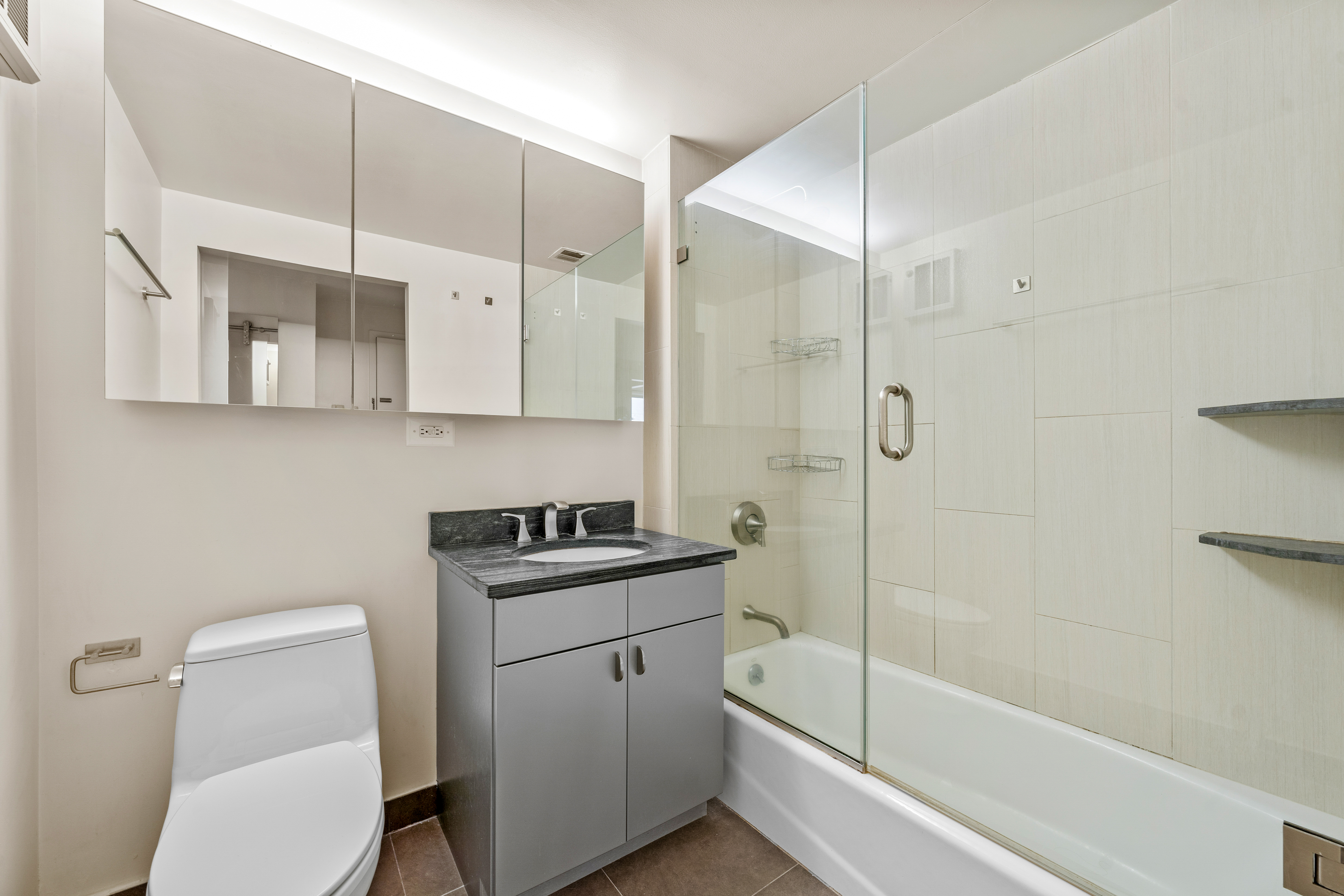 1810 3rd Avenue, Unit A9B Manhattan, NY 10029 - Photo 11 of 16 a bathroom with a sink a toilet and bathtub