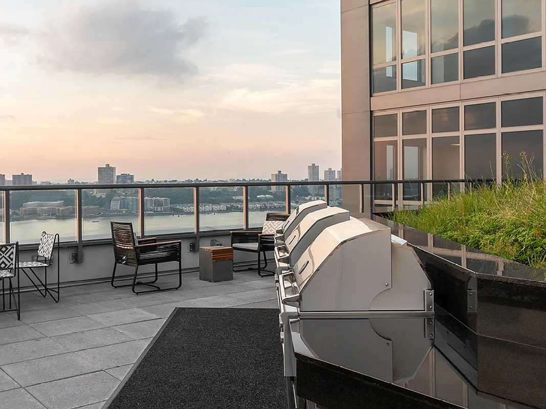 606 West 57th Street, Unit 1612 Manhattan, NY 10019 - Photo 9 of 18 a view of a roof deck with couches