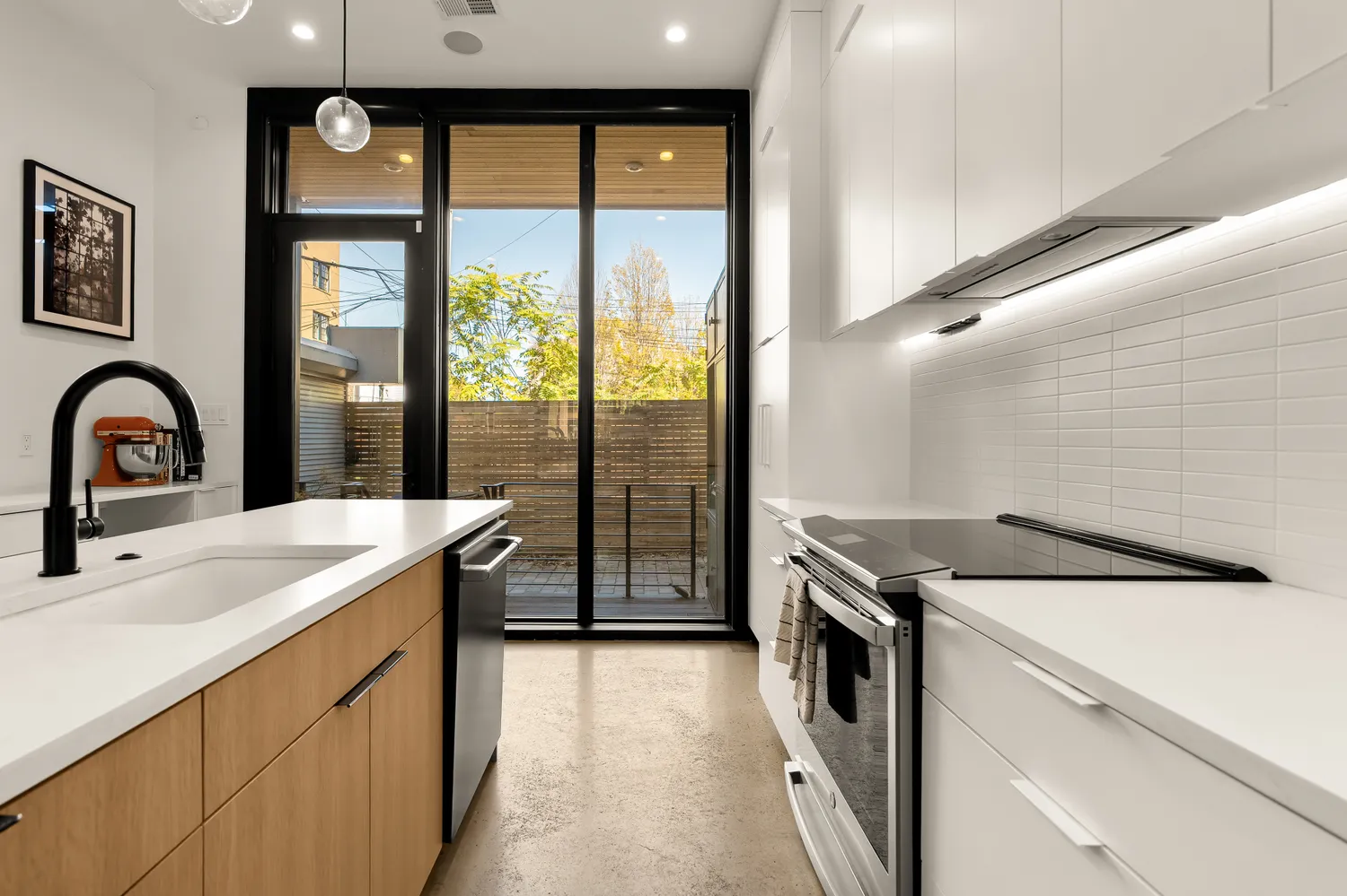 a kitchen that has a sink and a stove