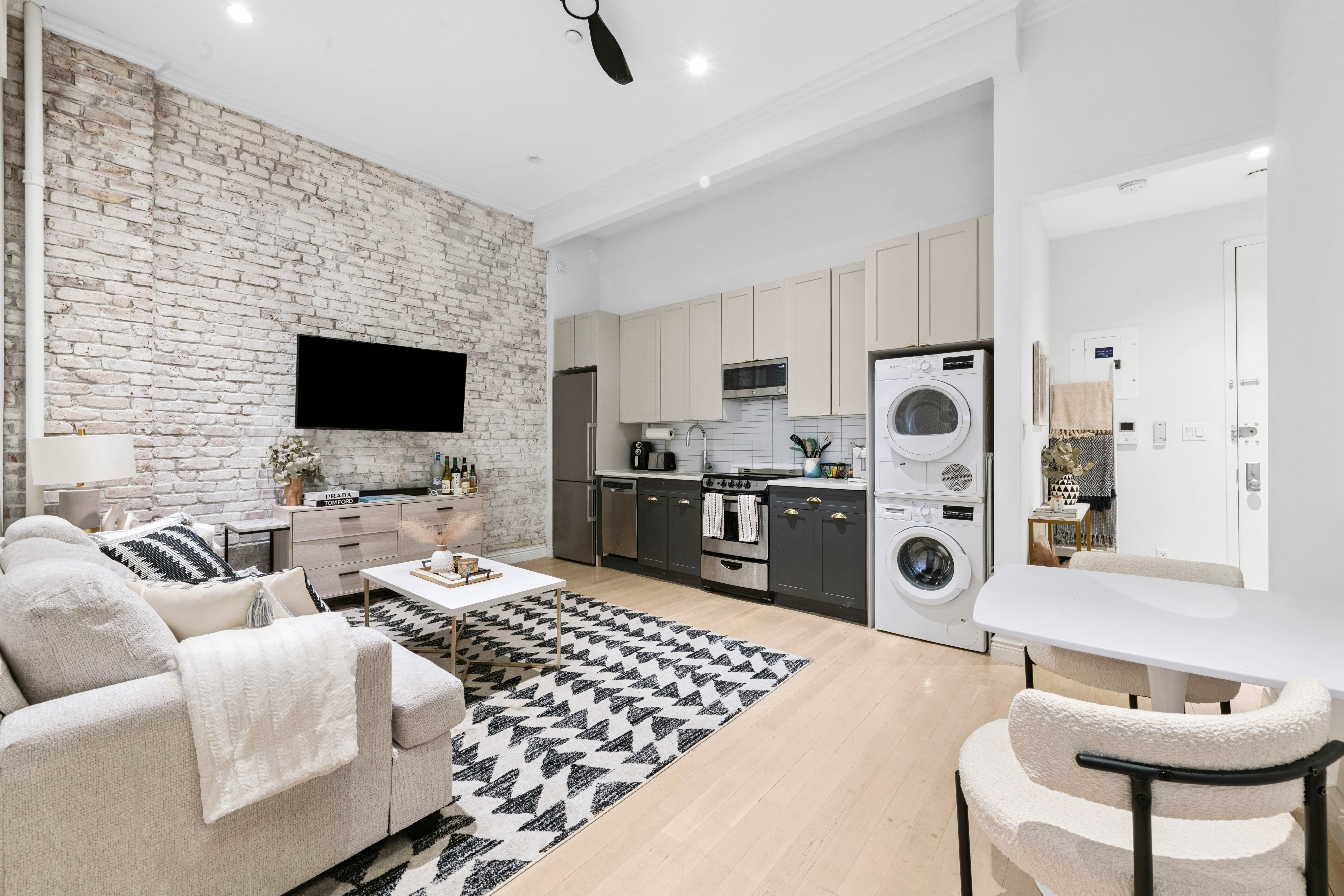 a living room with furniture and a flat screen tv