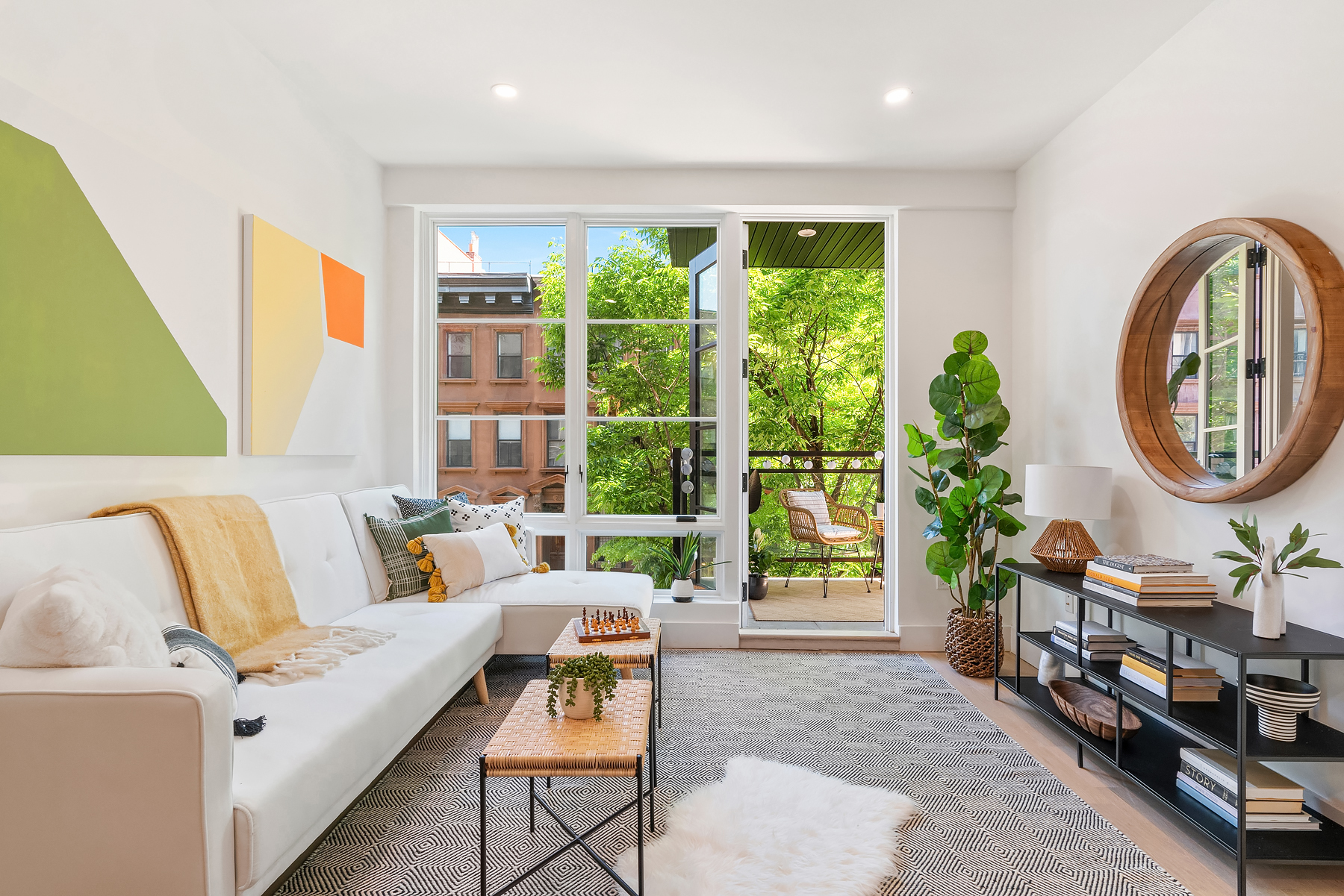 26 West 127th Street, Unit 4A Manhattan, NY 10027 - Photo 1 of 10 a living room with furniture and a large window