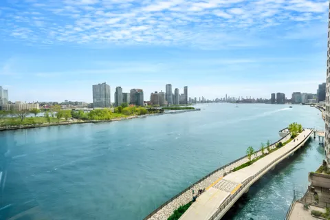 a view of a city with an ocean