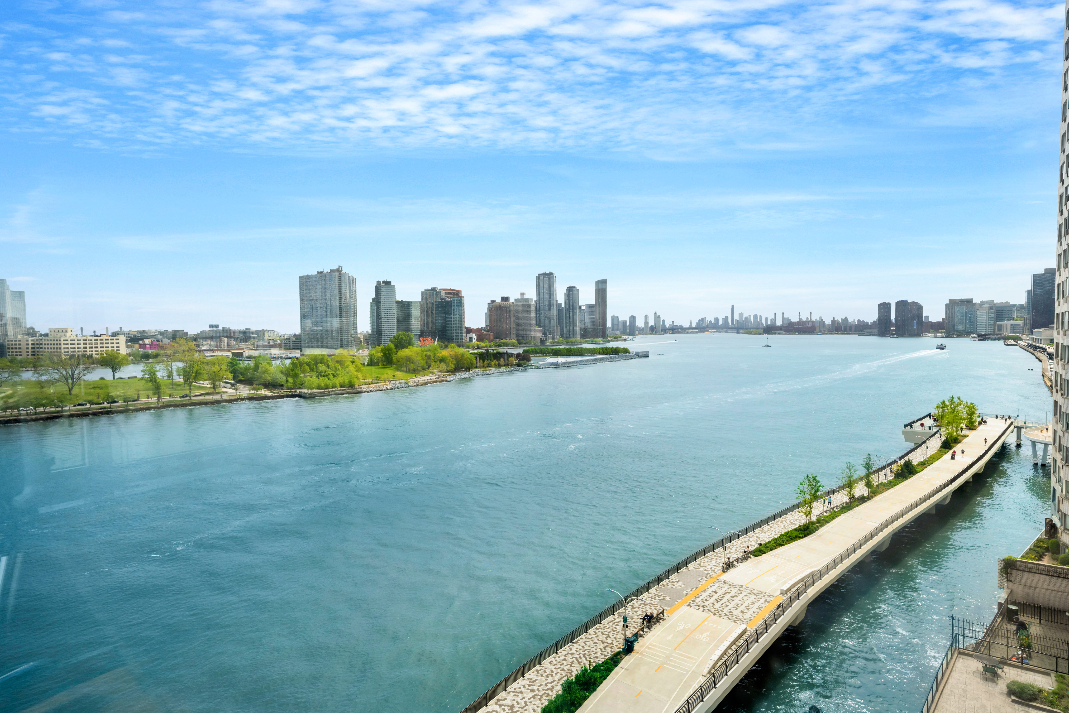 25 Sutton Place South, Unit 8G Manhattan, NY 10022 - Photo 10 of 22 a view of a city with an ocean