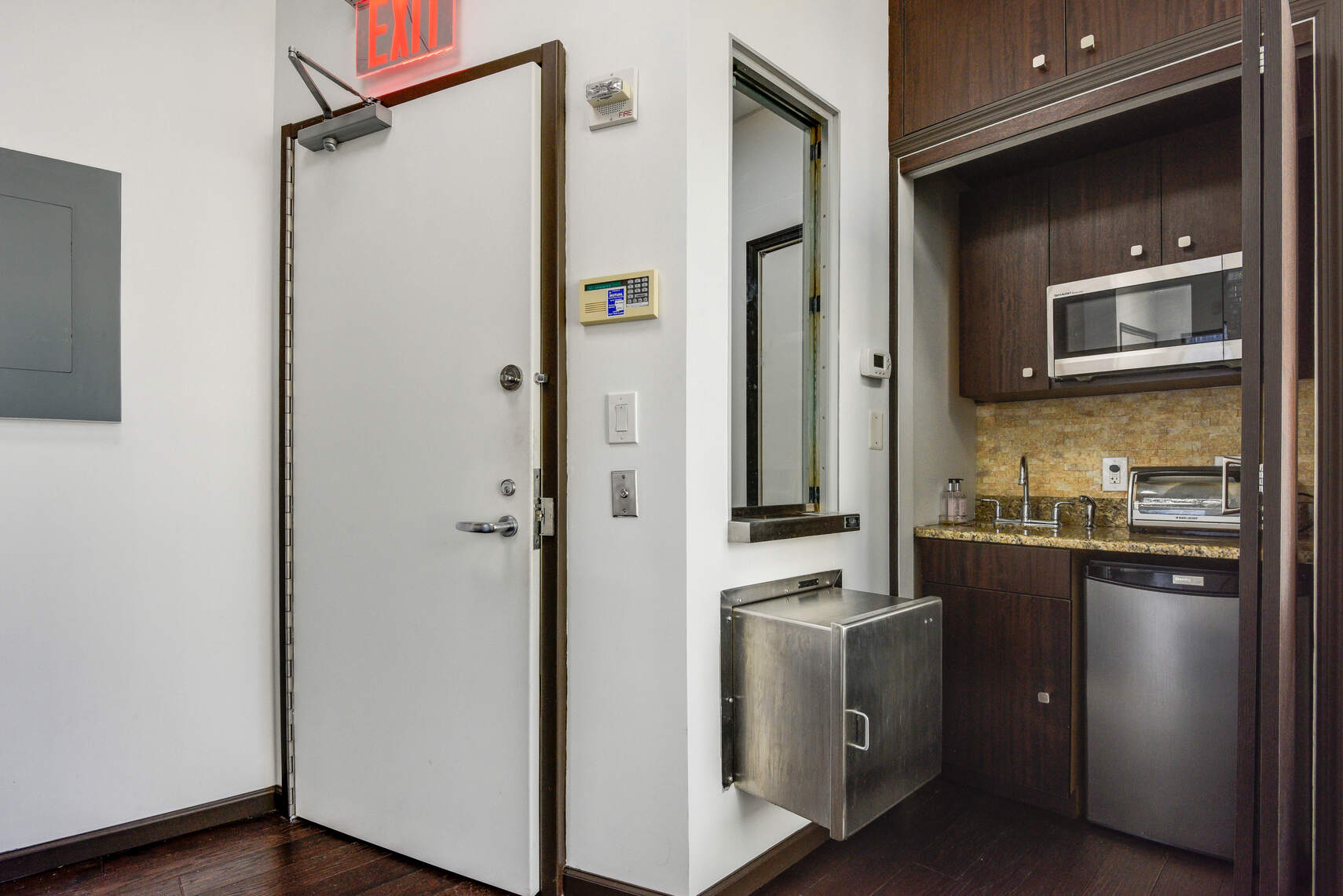 50 West 47th Street, Unit Undisclosed Manhattan, NY 10036 - Photo 9 of 27 a kitchen with a refrigerator stove and microwave