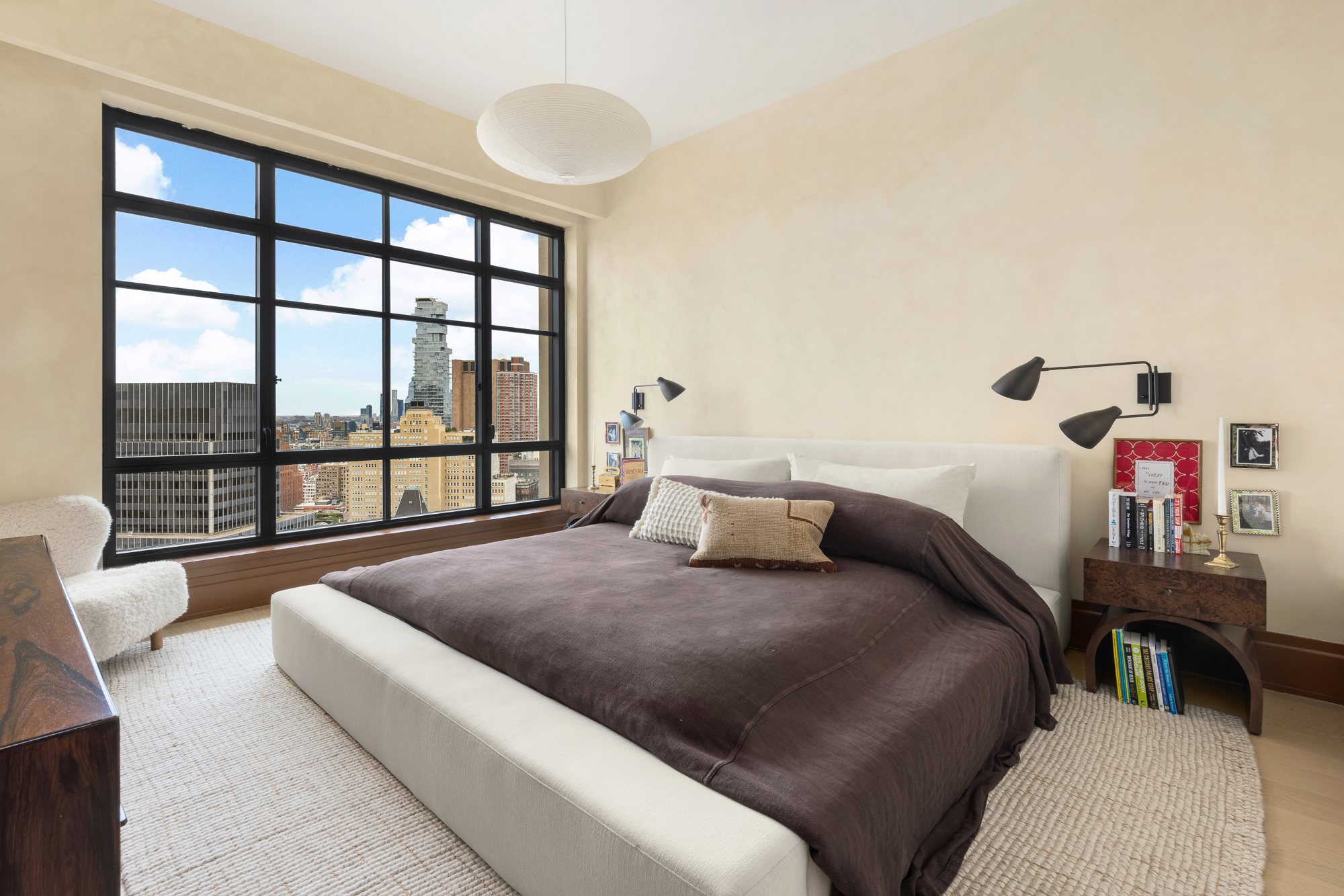 25 Park Row, Unit 29A Manhattan, NY 10038 - Photo 13 of 23 a bedroom with a bed and a large window