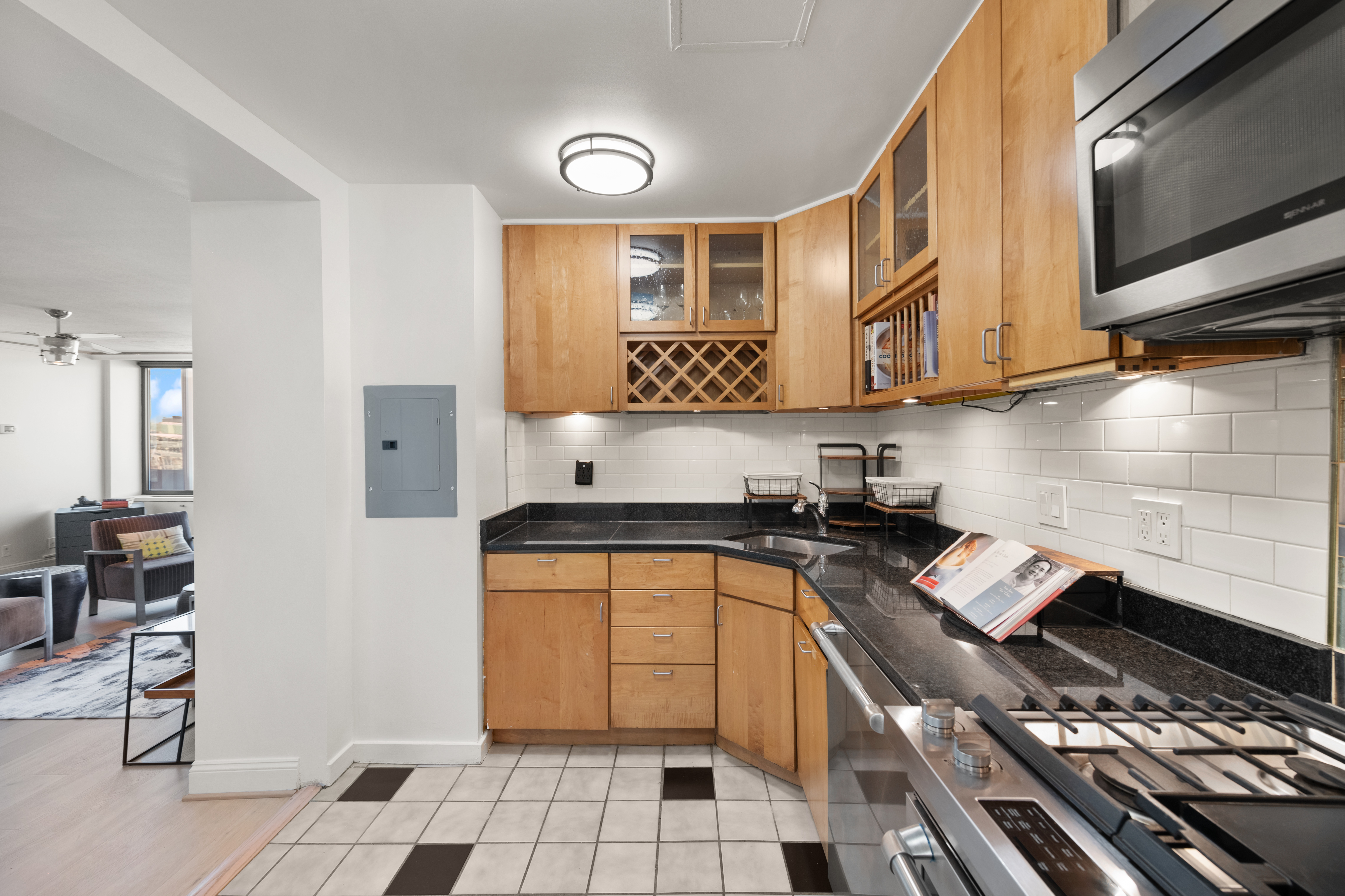 490 M Street Southwest, Unit W802 Washington, DC 20024 - Photo 12 of 24 a kitchen with stainless steel appliances a stove a sink and a microwave