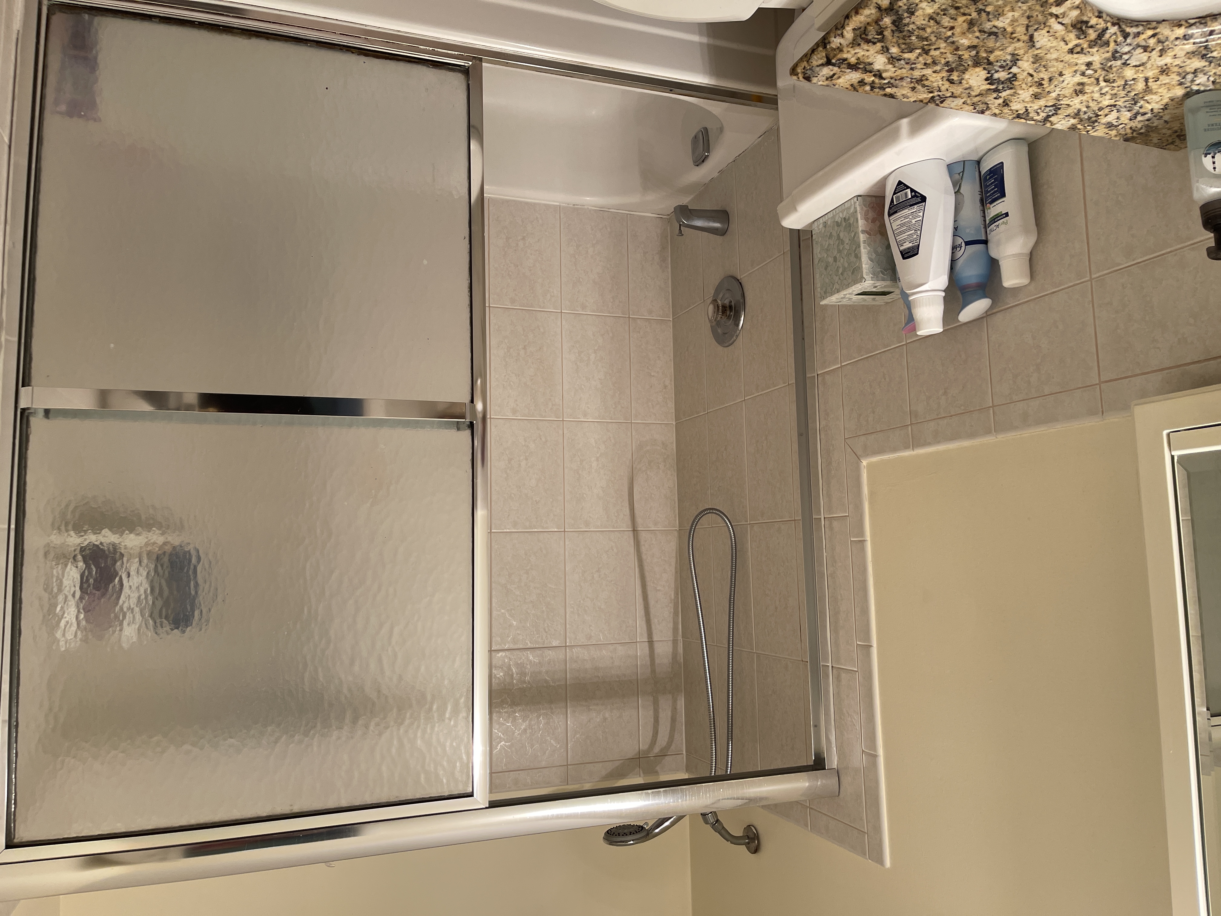 25-40 Shore Boulevard, Unit 5B Queens, NY 11102 - Photo 11 of 24 a bathroom with a bathtub and a shower