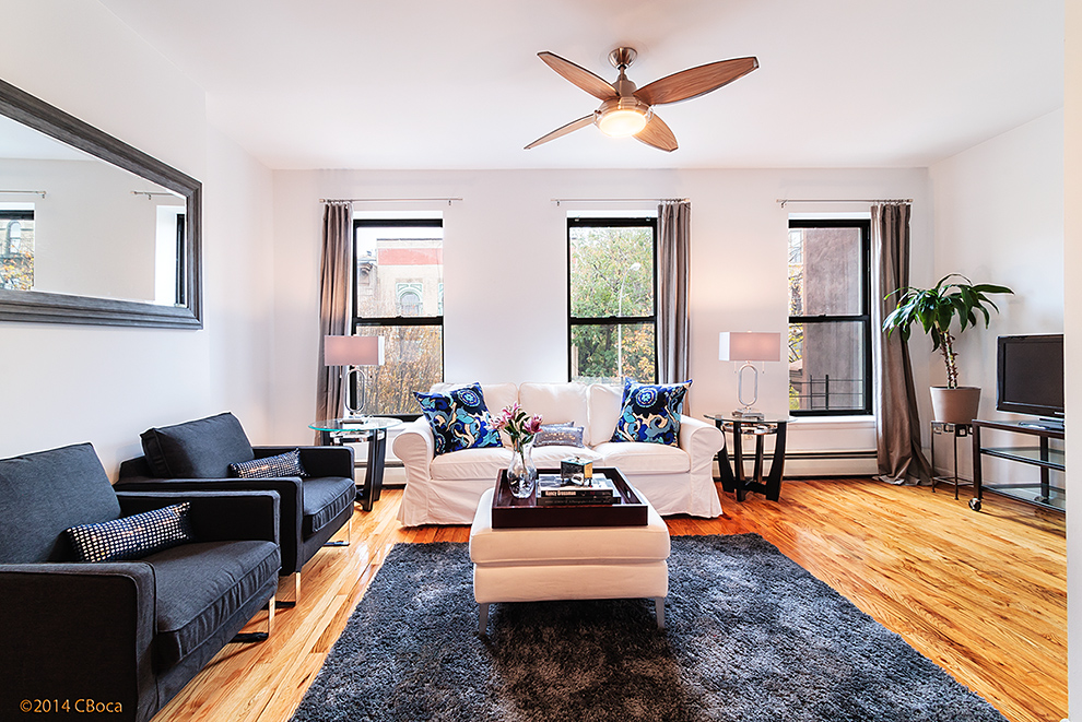 404 Classon Avenue, Unit 2 Brooklyn, NY 11238 - Photo 4 of 14 a living room with furniture wooden floor and a table