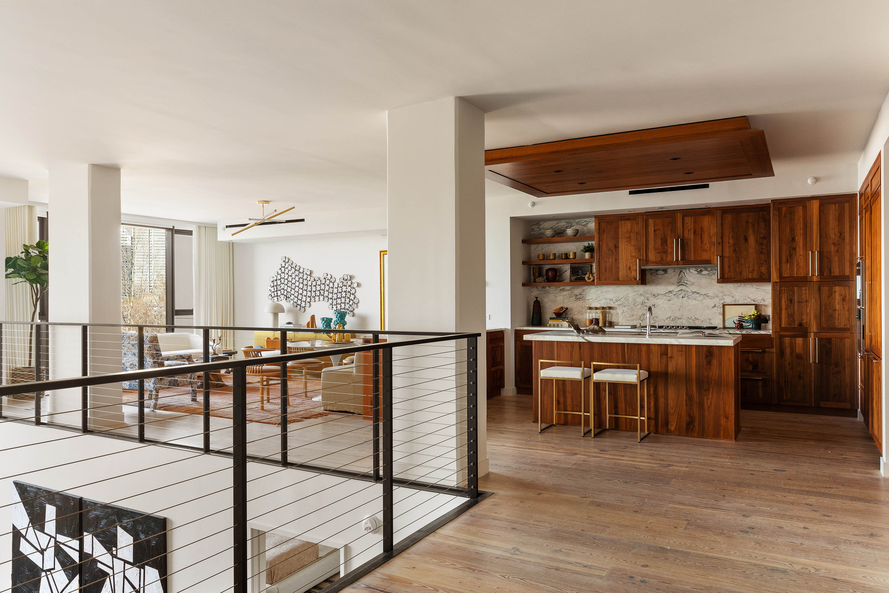 90 Furman Street, Unit N411 Brooklyn, NY 11201 - Photo 4 of 29 a open kitchen with stainless steel appliances kitchen island granite countertop a refrigerator a stove and a sink with wooden floor