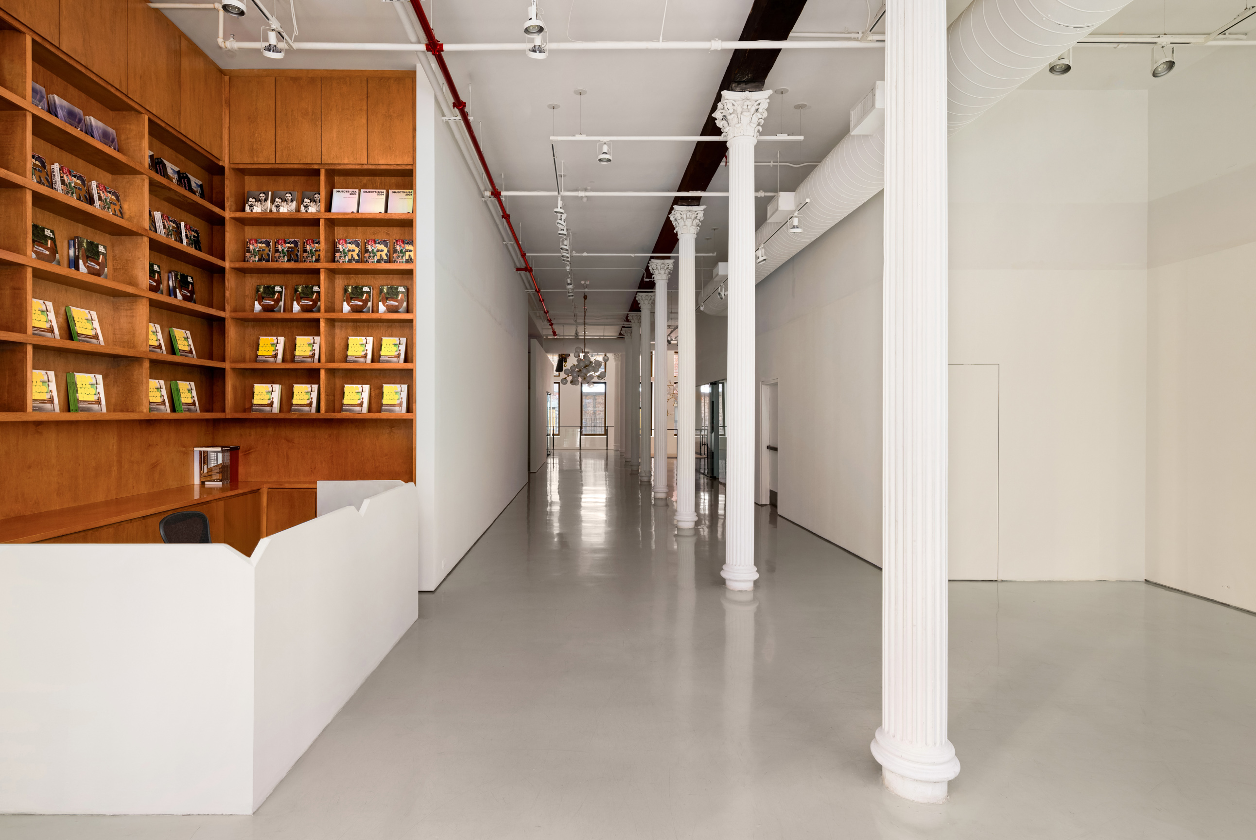64 White Street, Unit RETAIL Manhattan, NY 10013 - Photo 4 of 31 a view of a hallway with wooden floor and windows