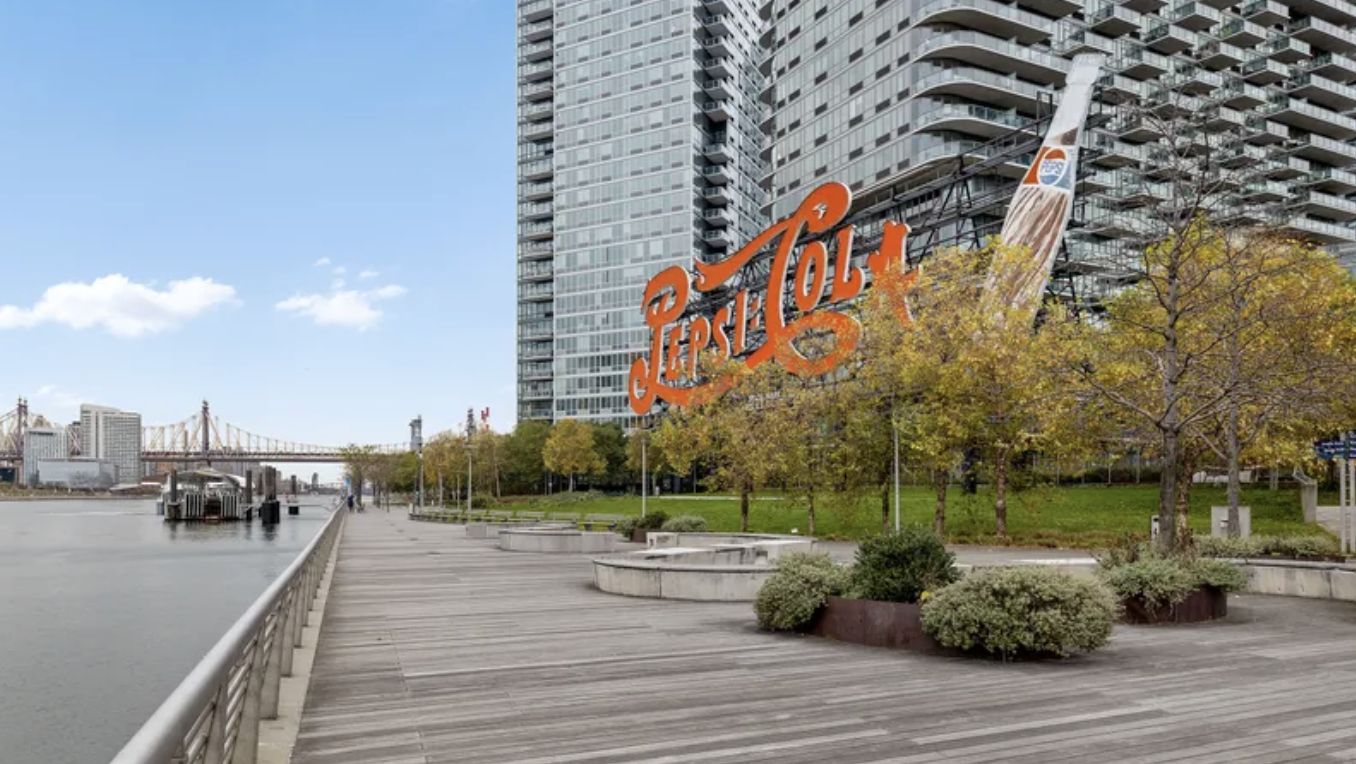 26-14 Jackson Avenue, Unit 9C Queens, NY 11101 - Photo 6 of 8 a terrace with outdoor seating and city view