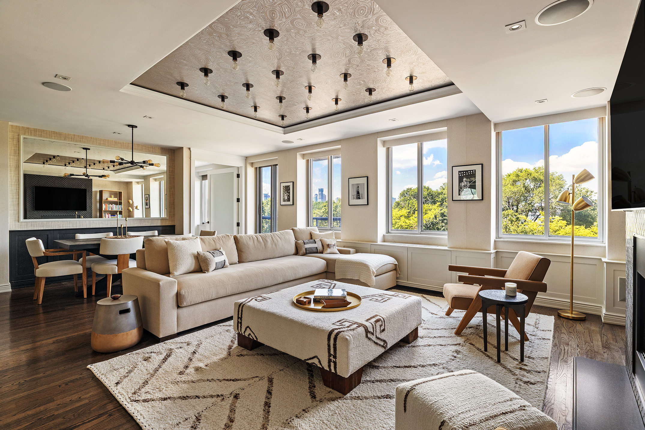 167 Perry Street, Unit 4NQ Manhattan, NY 10014 - Photo 1 of 20 a living room with furniture and wooden floor