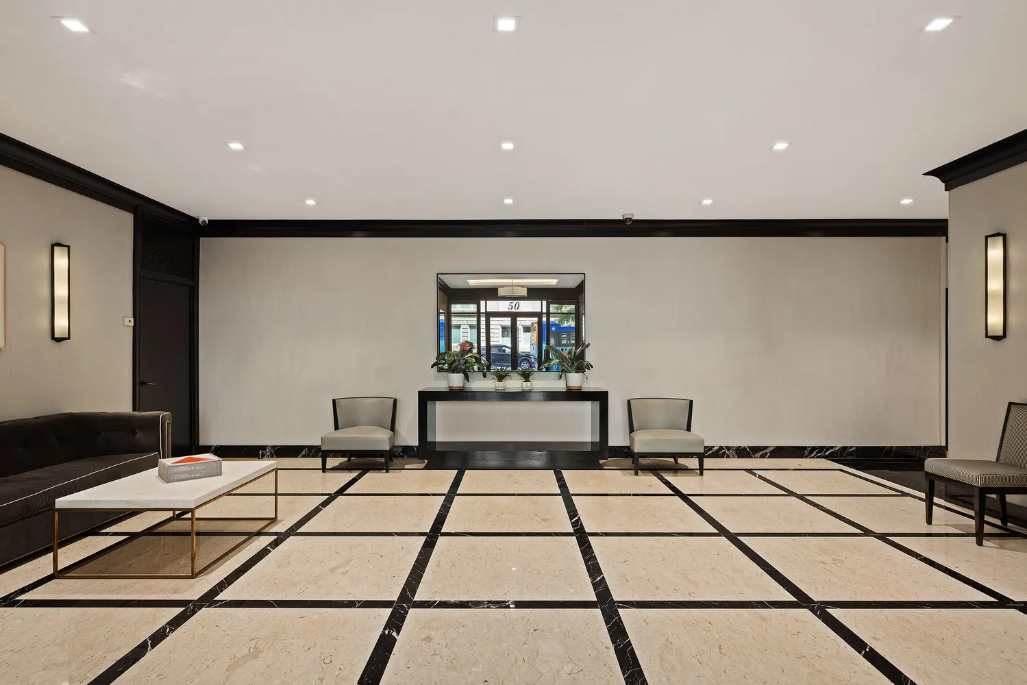 a black and white checkered floor with a rug