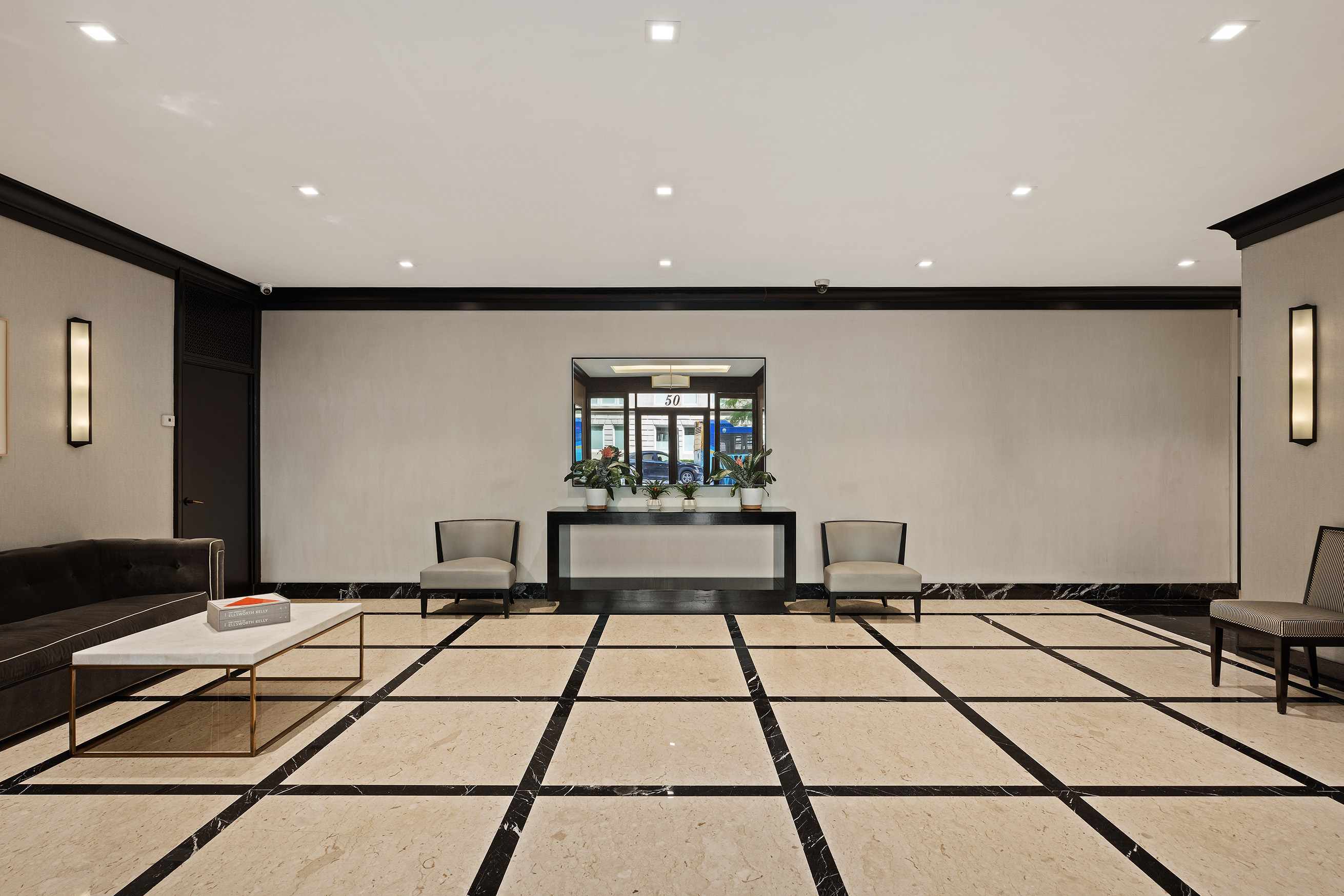 50 East 79th Street, Unit 7B Manhattan, NY 10075 - Photo 12 of 15 a black and white checkered floor with a rug